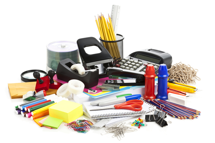 Large Assortment Of Office Supplies On White Backdrop